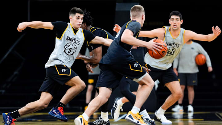 Iowa’s Peyton McCollum (5) and Joey Matteoni (44) defend Bennett Stirtz (14) during practice Oct. 15, 2025 at Carver-Hawkeye Arena in Iowa City, Iowa. Iowa’s Peyton McCollum (5) and Joey Matteoni (44) defend Bennett Stirtz (14) during practice Oct. 15, 2025 at Carver-Hawkeye Arena in Iowa City, Iowa.