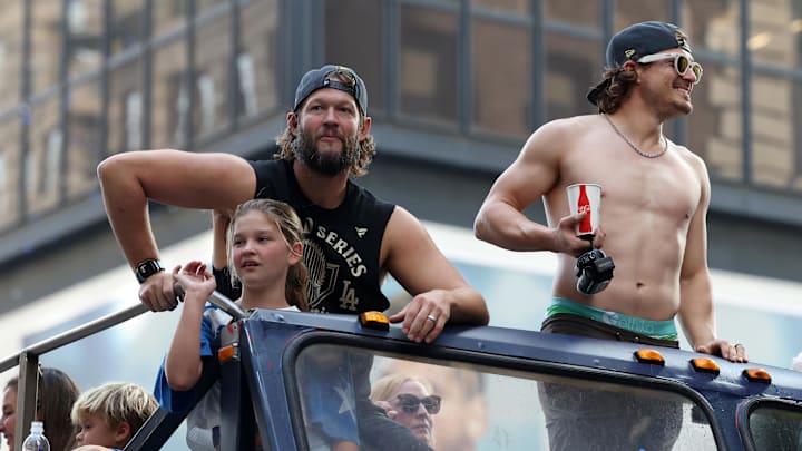 Nov 3, 2025; Los Angeles, CA, USA;  Los Angeles Dodgers pitcher Clayton Kershaw (left) and first baseman Enrique Hernandez acknowledge the crowd during the World Series championship parade at downtown Los Angeles. Mandatory Credit: Kiyoshi Mio-Imagn Images