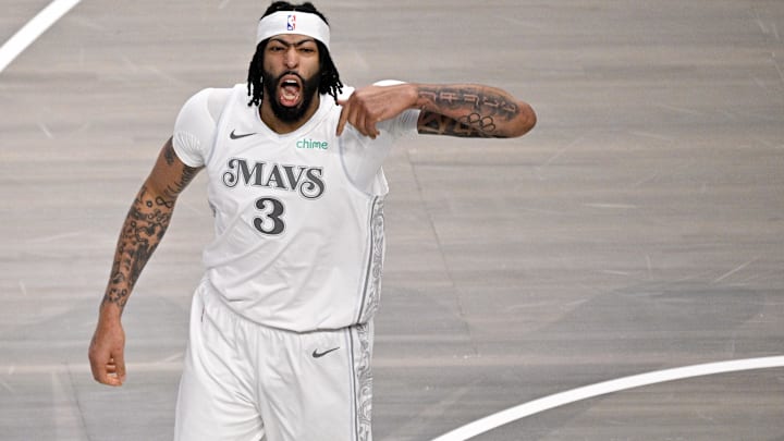Feb 8, 2025; Dallas, Texas, USA; Dallas Mavericks forward Anthony Davis (3) celebrates after he dunks the ball against the Houston Rockets during the first quarter at American Airlines Center. Mandatory Credit: Jerome Miron-Imagn Images