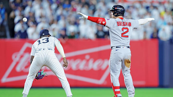 Sep 30, 2025; Bronx, New York, USA; Boston Red Sox third base Alex Bregman (2) reacts after hitting an RBI double during the ninth inning against the New York Yankees during game one of the Wildcard round for the 2025 MLB playoffs at Yankee Stadium. Mandatory Credit: Brad Penner-Imagn Images