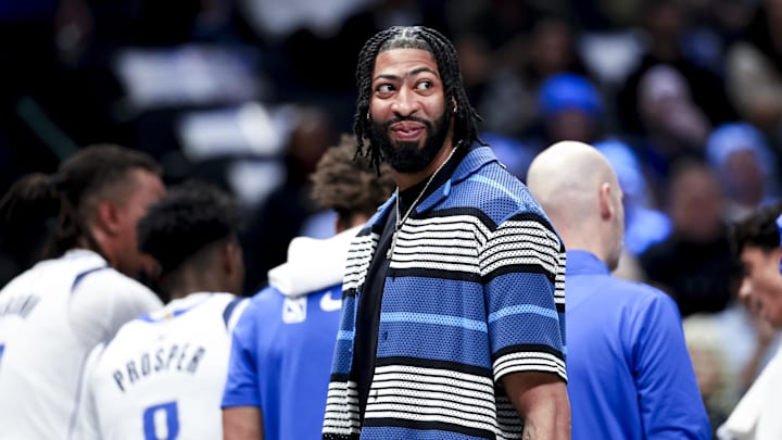 Feb 27, 2025; Dallas, Texas, USA;  Dallas Mavericks forward Anthony Davis laughs during a timeout against the Charlotte Hornets during the first half at American Airlines Center. Mandatory Credit: Kevin Jairaj-Imagn Images