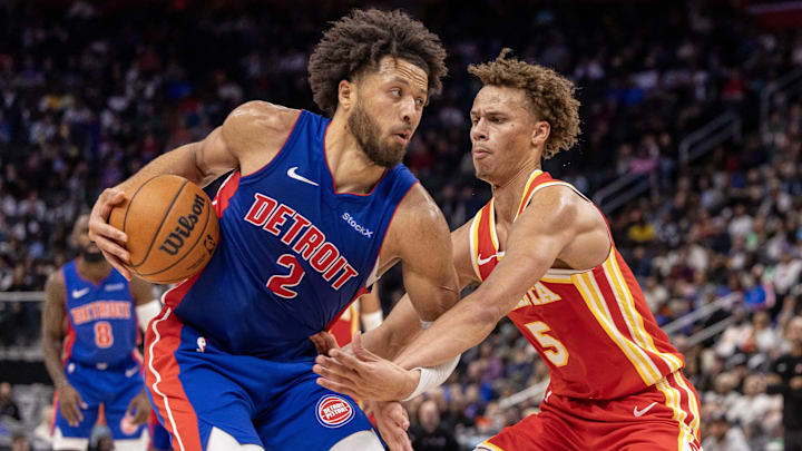 Nov 8, 2024; Detroit, Michigan, USA; Atlanta Hawks guard Dyson Daniels (5) defends against Detroit Pistons guard Cade Cunningham (2) during the second half at Little Caesars Arena. Mandatory Credit: David Reginek-Imagn Images
