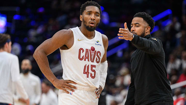 Oct 26, 2024; Washington, District of Columbia, USA; Cleveland Cavaliers guard Donovan Mitchell (45) speaks to Cleveland Cavaliers associate head coach Johnnie
Bryant during a time out in the third quarter against the Washington Wizards at Capital One Arena. Mandatory Credit: Reggie Hildred-Imagn Images