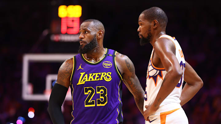 Oct 28, 2024; Phoenix, Arizona, USA; Los Angeles Lakers forward LeBron James (23) against Phoenix Suns forward Kevin Durant (35) at Footprint Center. Mandatory Credit: Mark J. Rebilas-Imagn Images