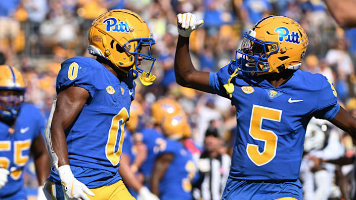 Sep 14, 2024; Pittsburgh, Pennsylvania, USA; Pittsburgh Panthers running back Desmond Reid celebrates with Raphael Williams Jr. (5) after a touchdown against the West Virginia Mountaineers during the second quarter at Acrisure Stadium. Mandatory Credit: Barry Reeger-Image Images