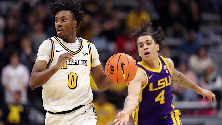 Missouri Tigers guards Anthony Robinson II (0) takes the ball down the court in a game versus the LSU Tigers this season.