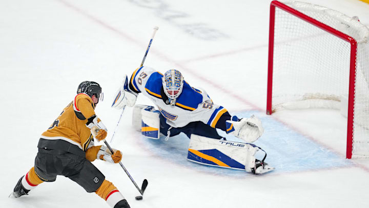 Jan 20, 2025; Las Vegas, Nevada, USA; Vegas Golden Knights left wing Pavel Dorofeyev (16) looks to shoot against St. Louis Blues goaltender Jordan Binnington (50) during a shoot out at T-Mobile Arena. Mandatory Credit: Stephen R. Sylvanie-Imagn Images