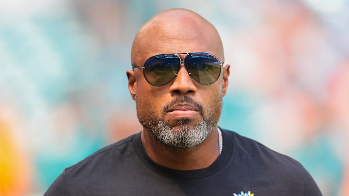 Oct 12, 2025; Miami Gardens, Florida, USA; Miami Dolphins defensive coordinator Anthony Weaver looks on before the game against the Los Angeles Chargers at Hard Rock Stadium. Mandatory Credit: Sam Navarro-Imagn Images Oct 12, 2025; Miami Gardens, Florida, USA; Miami Dolphins defensive coordinator Anthony Weaver looks on before the game against the Los Angeles Chargers at Hard Rock Stadium. Mandatory Credit: Sam Navarro-Imagn Images