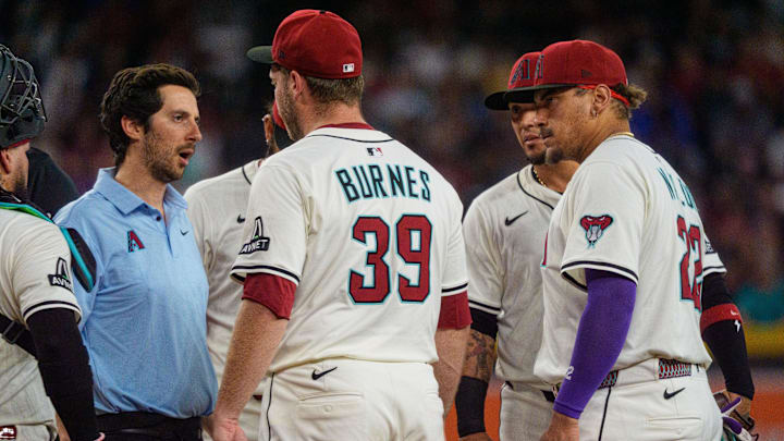 Jun 1, 2025; Phoenix, Arizona, USA; Arizona Diamondbacks starting pitcher Corbin Burnes (39) reacts after an injury in the fith inning and leaves the field against the Washington Nationals at Chase Field. Mandatory Credit: Allan Henry-Imagn Images