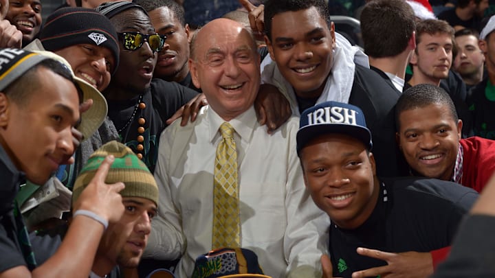 Nov 29, 2012; South Bend, IN, USA; ESPN analyst Dick Vitale poses for photos with members of the Notre Dame Fighting Irish football team before the basketball game between Notre Dame and the Kentucky Wildcats at the Purcell Pavilion. Notre Dame won 64-50. 