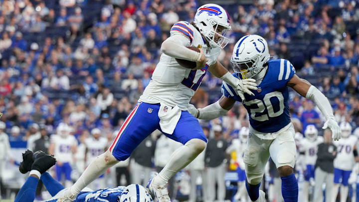 Indianapolis Colts safety Nick Cross (20) chases after Buffalo Bills quarterback Josh Allen (17)