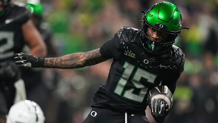 Oregon Ducks wide receiver Tez Johnson (15) rushes up the field Saturday, Dec. 7, 2024, during the Big Ten Championship game at Lucas Oil Stadium in Indianapolis.