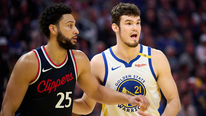 Apr 13, 2025; San Francisco, California, USA; Golden State Warriors center Quinten Post (21) gestures toward LA Clippers guard Ben Simmons (25) to confirm his defensive assignment during the first quarter at Chase Center. Mandatory Credit: Robert Edwards-Imagn Images
