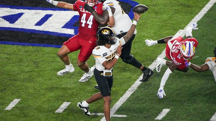 Sep 11, 2026; Lawrence, Kansas, USA; Missouri Tigers quarterback Austin Simmons (13) throws a pass against the Kansas Jayhawks during the first half of the game at David Booth Kansas Memorial Stadium. Mandatory Credit: Denny Medley-Imagn Images