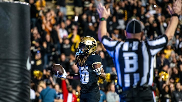 CU football's senior wide receiver Xavier Weaver shrugs to the crowd after scoring a game-winning