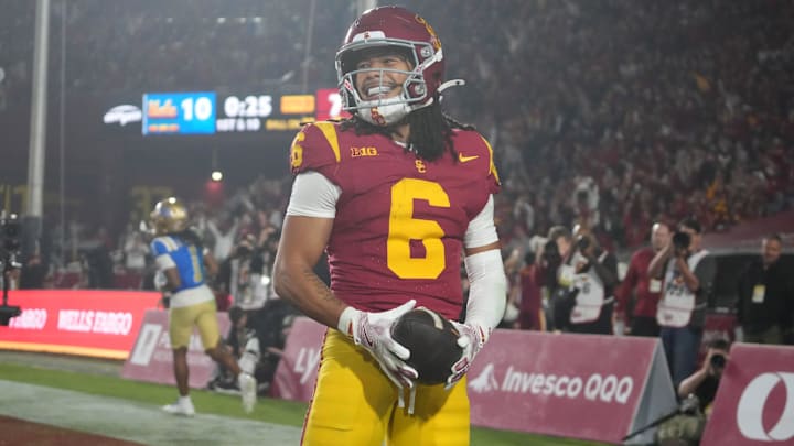 Nov 29, 2025; Los Angeles, California, USA; Southern California Trojans wide receiver Makai Lemon (6) celebrates after catching a 32-yard touchdown pass against the UCLA Bruins in the second half at United Airlines Field at Los Angeles Memorial Coliseum. Mandatory Credit: Kirby Lee-Imagn Images