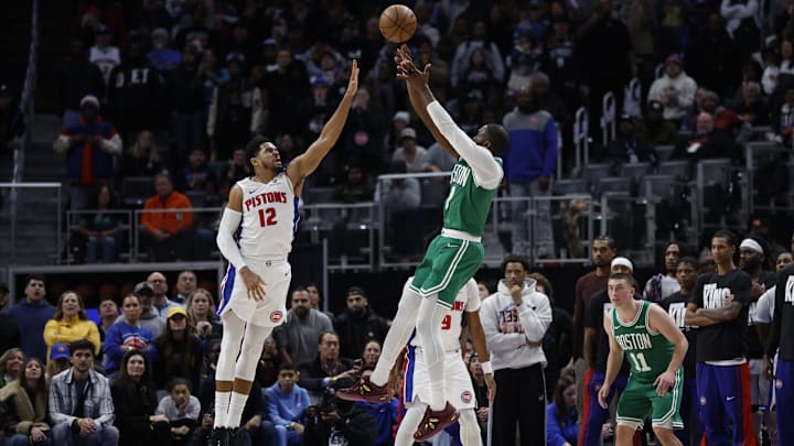 Jan 19, 2026; Detroit, Michigan, USA;  Boston Celtics guard Jaylen Brown (7) shoots the ball against Detroit Pistons forward Tobias Harris (12) in the second half at Little Caesars Arena. Mandatory Credit: Rick Osentoski-Imagn Images