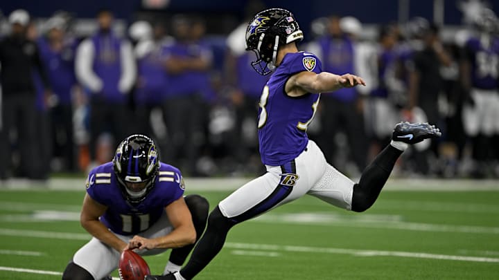 Aug 16, 2025; Arlington, Texas, USA; Baltimore Ravens punter Jordan Stout (11) holds the ball for place kicker Tyler Loop (33) during a field goal attempt during the game between the Dallas Cowboys and the Baltimore Ravens at AT&T Stadium. Mandatory Credit: Jerome Miron-Imagn Images Aug 16, 2025; Arlington, Texas, USA; Baltimore Ravens punter Jordan Stout (11) holds the ball for place kicker Tyler Loop (33) during a field goal attempt during the game between the Dallas Cowboys and the Baltimore Ravens at AT&T Stadium. Mandatory Credit: Jerome Miron-Imagn Images