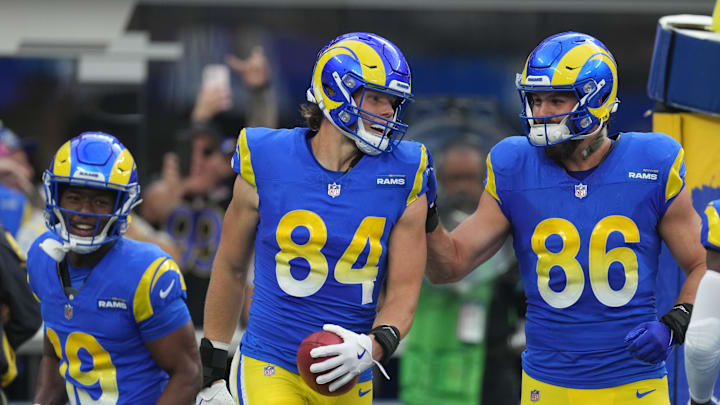 Dec 8, 2024; Inglewood, California, USA; Los Angeles Rams tight end Hunter Long (84) celebrates with wide receiver Xavier Smith (19) and tight end Colby Parkinson (86) after scoring a touchdown on a blocked punt against the Buffalo Bills in the first half at SoFi Stadium. Mandatory Credit: Kirby Lee-Imagn Images
