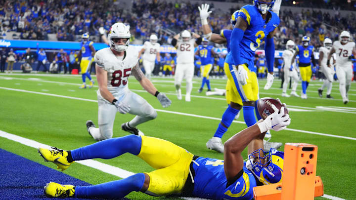 Dec 28, 2024; Inglewood, California, USA; Los Angeles Rams cornerback Ahkello Witherspoon (4) intercepts a pass with 42 seconds left against the Arizona Cardinals at SoFi Stadium. Mandatory Credit: Kirby Lee-Imagn Images