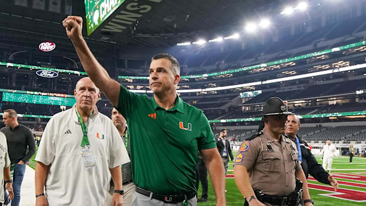 Dec 31, 2025; Arlington, TX, USA; Miami Hurricanes head coach Mario Cristobal leaves the field following the 2025 Cotton Bowl and quarterfinal game of the College Football Playoff against the Ohio State Buckeyes at AT&T Stadium. Mandatory Credit: Raymond Carlin III-Imagn Images