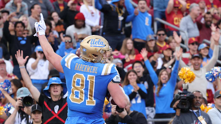 Nov 18, 2023; Los Angeles, California, USA; UCLA Bruins tight end Hudson Habermehl (81) celebrates after a touchdown during the first quarter against the USC Trojans at United Airlines Field at Los Angeles Memorial Coliseum. Mandatory Credit: Jason Parkhurst-Imagn Images