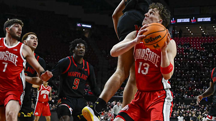 Feb 5, 2026; College Park, Maryland, USA; Maryland Terrapins center Collin Metcalf (45) defends thew rim as Ohio State Buckeyes center Christoph Tilly (13) looks top shoot during the first half at Xfinity Center. Mandatory Credit: Tommy Gilligan-Imagn Images Feb 5, 2026; College Park, Maryland, USA; Maryland Terrapins center Collin Metcalf (45) defends thew rim as Ohio State Buckeyes center Christoph Tilly (13) looks top shoot during the first half at Xfinity Center. Mandatory Credit: Tommy Gilligan-Imagn Images