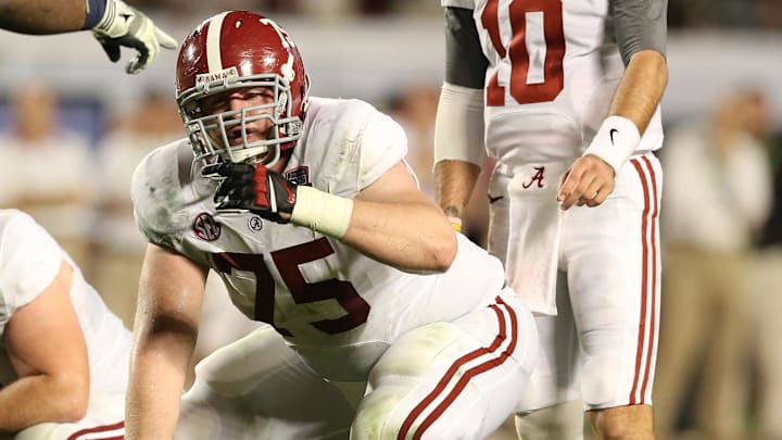 Jan 7, 2013; Miami, FL, USA; Alabama Crimson Tide center Barrett Jones (75) signals with quarterback A.J. McCarron (10) during the game against the Notre Dame Fighting Irish during the 2013 BCS Championship game at Sun Life Stadium. Alabama won 42-14.  Mandatory Credit: Matthew Emmons-Imagn Images