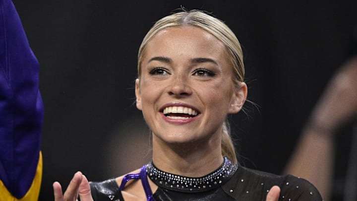 Apr 17, 2025; Fort Worth, TX, USA; LSU Tigers gymnast Olivia Dunne cheers for the LSU gymnastic team during the 2025 Women's National Gymnastics Semifinal at Dickies Arena.