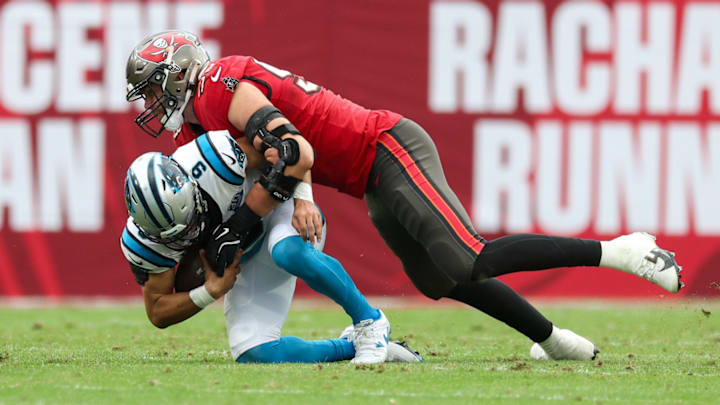 Dec 29, 2024; Tampa, Florida, USA; Tampa Bay Buccaneers linebacker Anthony Nelson (98) sacks Carolina Panthers quarterback Bryce Young (9) in the third quarter at Raymond James Stadium. 