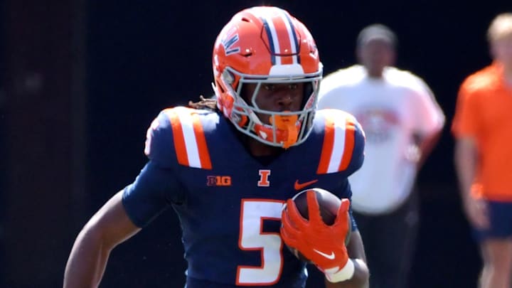 Sep 14, 2024; Champaign, Illinois, USA;  Illinois Fighting Illini running back Ca'Lil Valentine (5) during the first half at Memorial Stadium. Mandatory Credit: Ron Johnson-Imagn Images