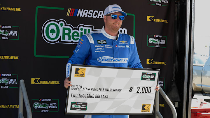 Austin Hill shows off his $2,000 check for taking home the pole position in Saturday's NASCAR O'Reilly Auto Parts Series United Rentals 300 at Daytona International Speedway. Austin Hill shows off his $2,000 check for taking home the pole position in Saturday's NASCAR O'Reilly Auto Parts Series United Rentals 300 at Daytona International Speedway.