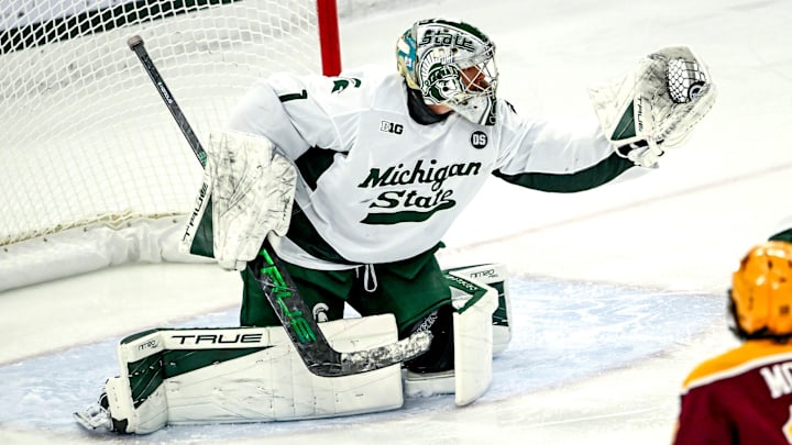 Michigan State's Trey Augustine catches a Minnesota shot during the first period on Friday, Jan. 23, 2026, at Munn Ice Arena in East Lansing.