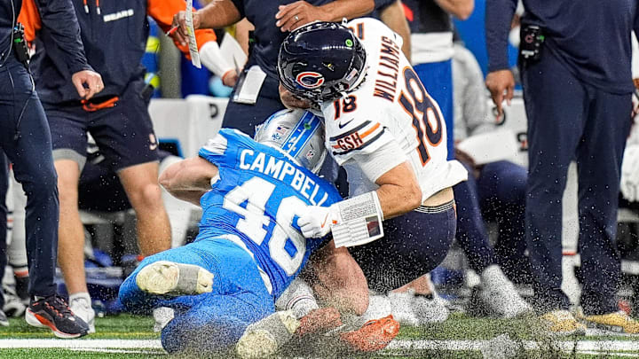 Detroit Lions linebacker Jack Campbell tackles Chicago Bears quarterback Caleb Williams on Thursday, Nov. 28, 2024.