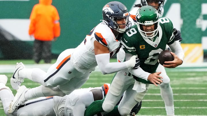 Sep 29, 2024; East Rutherford, New Jersey, USA; Denver Broncos linebacker Jonah Elliss (52) and Denver Broncos defensive tackle Malcolm Roach (97) sack New York Jets quarterback Aaron Rodgers (8) during the fourth quarter at MetLife Stadium. Sep 29, 2024; East Rutherford, New Jersey, USA; Denver Broncos linebacker Jonah Elliss (52) and Denver Broncos defensive tackle Malcolm Roach (97) sack New York Jets quarterback Aaron Rodgers (8) during the fourth quarter at MetLife Stadium.