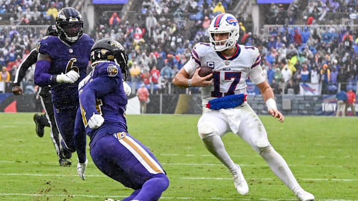 Oct 2, 2022; Baltimore, Maryland, USA;  Buffalo Bills quarterback Josh Allen (17) runs as Baltimore Ravens cornerback Marlon Humphrey (44) defends during the third quarter at M&T Bank Stadium. Mandatory Credit: Tommy Gilligan-Imagn Images