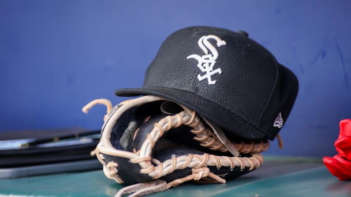 A detailed view of a Chicago White Sox hat and glove in the dugout against the Atlanta Braves in the first inning at Truist Park A detailed view of a Chicago White Sox hat and glove in the dugout against the Atlanta Braves in the first inning at Truist Park