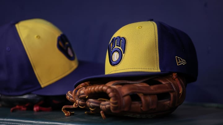 Jul 28, 2023; Atlanta, Georgia, USA; A detailed view of a Milwaukee Brewers hat and glove on the bench against the Atlanta Braves in the second inning at Truist Park. Mandatory Credit: Brett Davis-Imagn Images Jul 28, 2023; Atlanta, Georgia, USA; A detailed view of a Milwaukee Brewers hat and glove on the bench against the Atlanta Braves in the second inning at Truist Park. Mandatory Credit: Brett Davis-Imagn Images