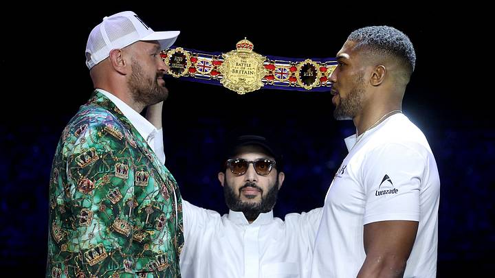 LONDON, ENGLAND - SEPTEMBER 30: Tyson Fury and Anthony Joshua face off as Turki Al-Sheikh, Chairman of the General Entertainment Authority, watches on during the announcement for the upcoming Tyson Fury vs. Anthony Joshua fight at The British Airways Arc on September 30, 2026 in London, England. The fight will stream live on Netflix on 11th December. (Photo by Richard Pelham/Getty Images for Netflix)
