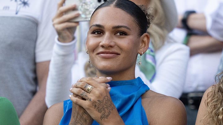 Trinity Rodman reacts to Ben Shelton of the United States winning his match against Lorenzo Sonego of Italy on day eight at All England Lawn Tennis and Croquet Club. Trinity Rodman reacts to Ben Shelton of the United States winning his match against Lorenzo Sonego of Italy on day eight at All England Lawn Tennis and Croquet Club.