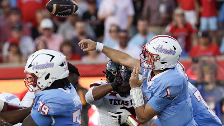Oct 4, 2025; Houston, Texas, USA; Houston Cougars quarterback Conner Weigman (1) completes a pass against the Texas Tech Raiders in the first half at TDECU Stadium. Mandatory Credit: Thomas Shea-Imagn Images Oct 4, 2025; Houston, Texas, USA; Houston Cougars quarterback Conner Weigman (1) completes a pass against the Texas Tech Raiders in the first half at TDECU Stadium. Mandatory Credit: Thomas Shea-Imagn Images