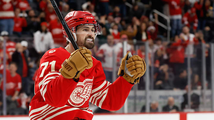 Dec 2, 2025; Detroit, Michigan, USA;  Detroit Red Wings center Dylan Larkin (71) celebrates a goal by defenseman Ben Chiarot (not pictured) in the second period against the Boston Bruins at Little Caesars Arena. Mandatory Credit: Rick Osentoski-Imagn Images