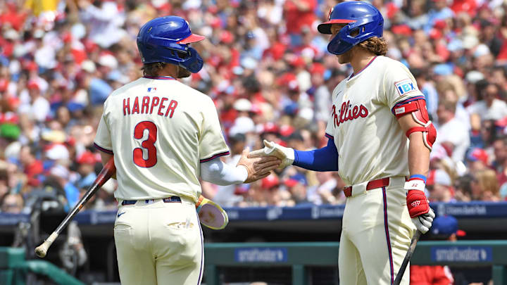 Apr 20, 2025; Philadelphia, Pennsylvania, USA; Philadelphia Phillies first base Bryce Harper (3) celebrates after scoring a run during the first inning with third base Alec Bohm (28) against the Miami Marlins at Citizens Bank Park.