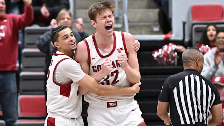 Feb 8, 2025; Pullman, Washington, USA; Washington State Cougars forward Dane Erikstrup (32) and guard Isaiah Watts (12) celebrate after a play against the Pepperdine Waves in the second half at Friel Court at Beasley Coliseum. Washington State Cougars won 87-86. Mandatory Credit: James Snook-Imagn Images