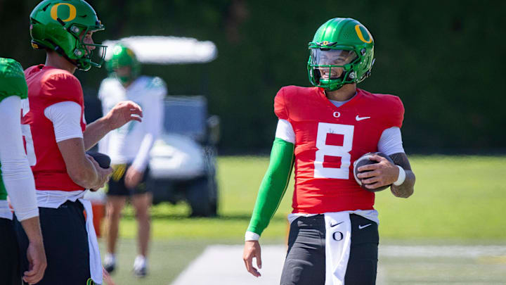 Oregon quarterback Dillon Gabriel walks the field during practice with the Ducks Tuesday, Aug. 13, 2024 at the Hatfield-Dowlin Complex in Eugene, Ore.