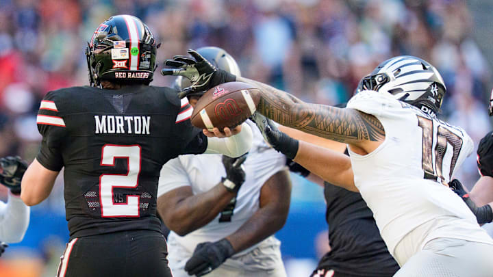 Oregon outside linebacker Matayo Uiagalelei, right, strips the ball from Texas Tech quarterback Behren Morton as the Oregon Ducks take on the Texas Tech Red Raiders in the Orange Bowl on Jan. 1, 2026, at Hard Rock Stadium in Miami, Florida.