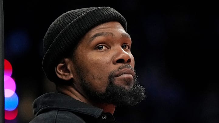 Phoenix Suns forward Kevin Durant (35) watches game action against the Orlando Magic during the second half of an NBA game at Footprint Center.