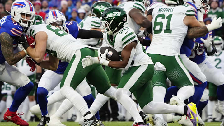 Dec 29, 2024; Orchard Park, New York, USA; New York Jets running back Breece Hall (20) runs with the ball against the Buffalo Bills during the first half at Highmark Stadium. Mandatory Credit: Gregory Fisher-Imagn Images