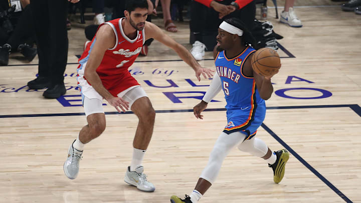 Apr 26, 2025; Memphis, Tennessee, USA; Oklahoma City Thunder guard Luguentz Dort (5) passes the ball as Memphis Grizzlies forward Santi Aldama (7) defends during the first quarter during game four for the first round of the 2024 NBA Playoffs at FedExForum. Mandatory Credit: Petre Thomas-Imagn Images Apr 26, 2025; Memphis, Tennessee, USA; Oklahoma City Thunder guard Luguentz Dort (5) passes the ball as Memphis Grizzlies forward Santi Aldama (7) defends during the first quarter during game four for the first round of the 2024 NBA Playoffs at FedExForum. Mandatory Credit: Petre Thomas-Imagn Images