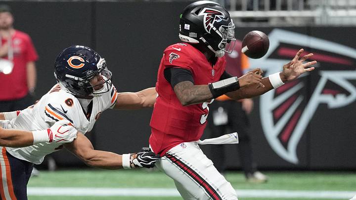 From one ex-Husky to another, Bears cornerback back Kyler Gordon (6) strips the ball from Falcons quarterback Michael Penix Jr. From one ex-Husky to another, Bears cornerback back Kyler Gordon (6) strips the ball from Falcons quarterback Michael Penix Jr.